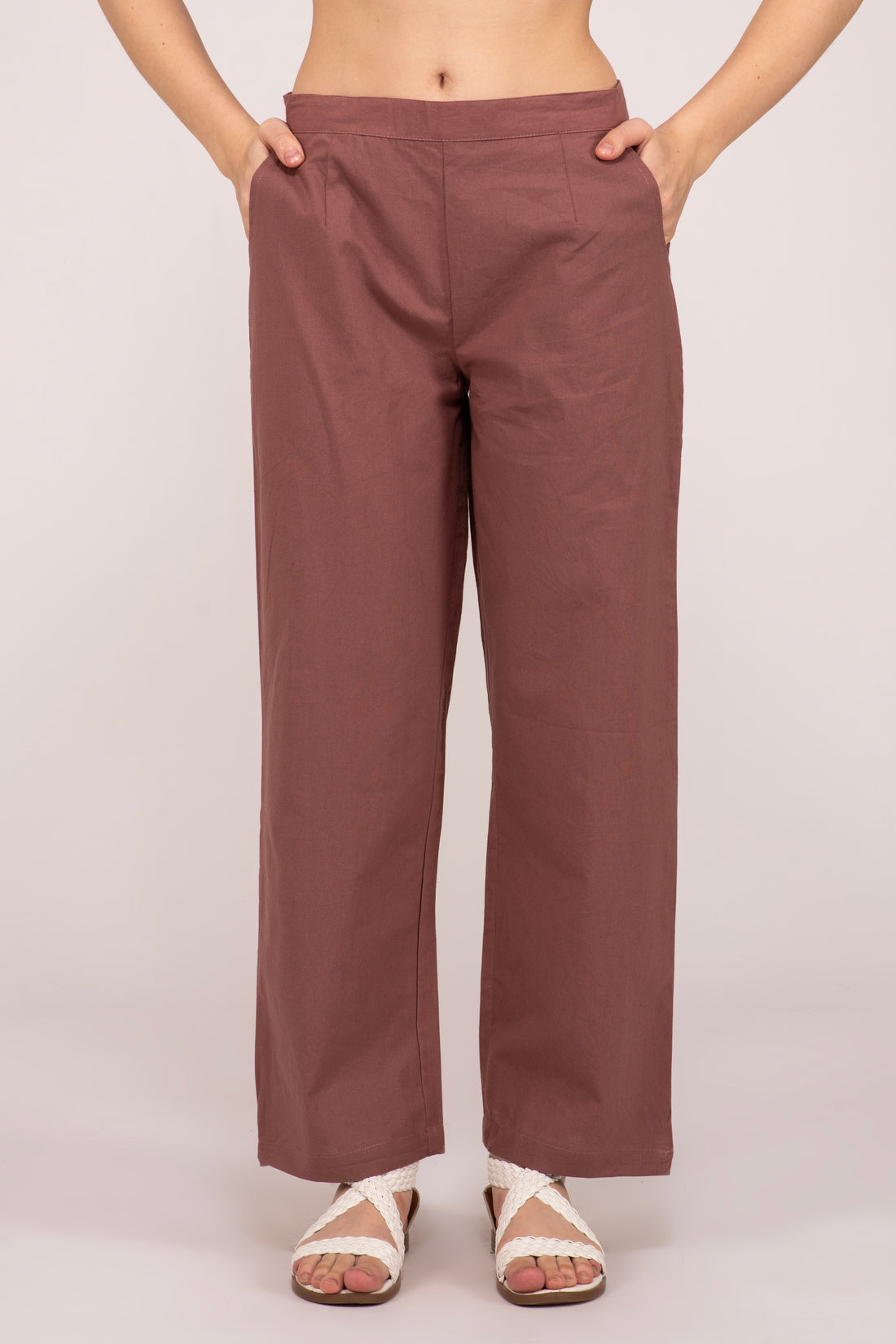 Shop our collection of Rose taupe wide leg cotton pants for women. Enjoy the blend of style and comfort with two deep pockets and a half-elasticated waist. Available in multiple colors and sizes at affordable prices at Albelie.
