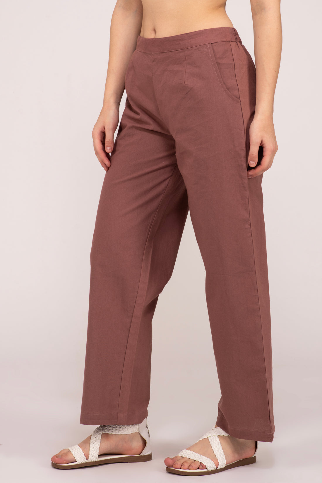 Shop our collection of Rose taupe wide leg cotton pants for women. Enjoy the blend of style and comfort with two deep pockets and a half-elasticated waist. Available in multiple colors and sizes at affordable prices at Albelie.